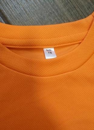 Спортивна оранжева футболка 7-8 років2 фото