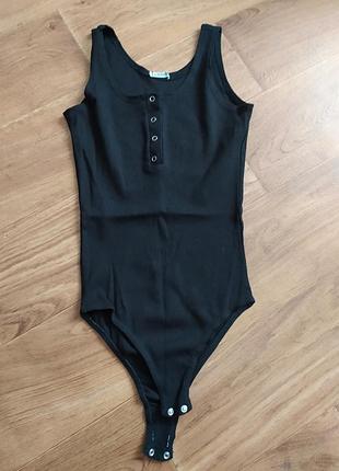 Чорний трикотажний боді в рубчик