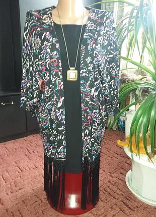 Накидка з бахромою dinatricot p.s