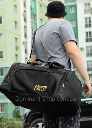 Большая дорожная спортивная сумка nike biz yellow черная тканевая на 60 литров для путешествий командировок3 фото