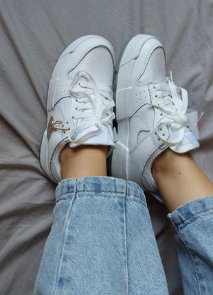 Білі, шкіряні жіночі кросівки nike dunk low disrupt white10 фото