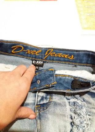 Рванные джинсовые шорты с высокой посадкой4 фото