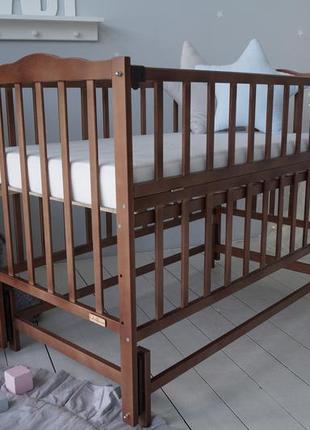 Кровать детская baby comfort малюк с маятником орех1 фото