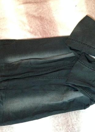 Елевые завышенные джинсы темного цвета с растягивающейся тканью1 фото