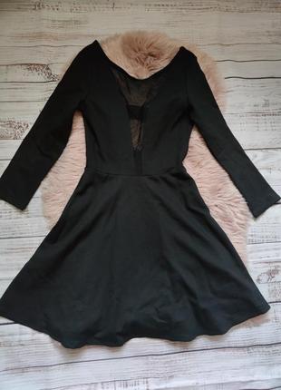 Чорна трикотажна сукня з вставкою - сітка та відкритою спиною4 фото