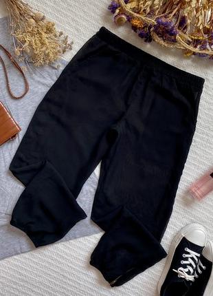 Тонкие прозрачные шифоновые брюки чёрного цвета в манжетами