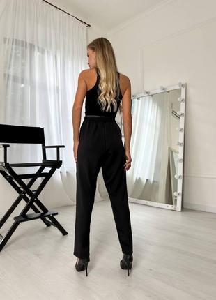 Женские черный брюки с карманами со стрелкой на высокой посадке стильные классические повседневные однотонные на резинке4 фото
