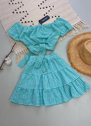 Літній бірюзовий костюм у клітинку