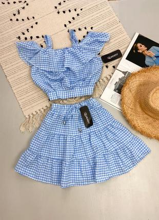 Блакитний літній костюм зі спідницею міні