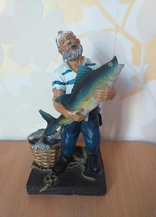 Статуэтка в морському стилі "моряк та риба" із черногорії1 фото
