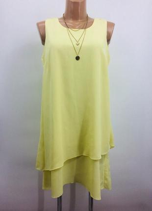 Шикарное фирменное платье а-силуэта желтого цвета.