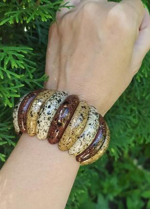 Браслет з дзвінкого) пластику на рещинці нахуду ручку