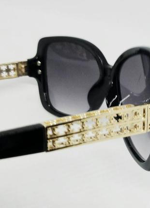 Chanel женские брендовые солнцезащитные очки чёрные с золотом7 фото