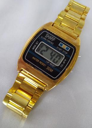 Часы электронные "sharp" ,новые.