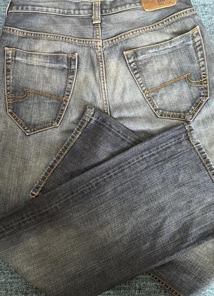 Классические джинсы от известного бренда.8 фото