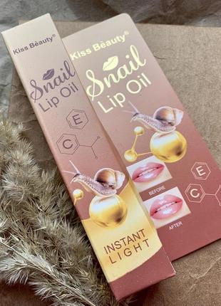 Блеск для увеличения оъёма губ snail lip oil2 фото