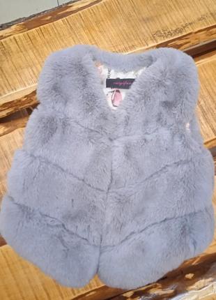 Меховая жилетка