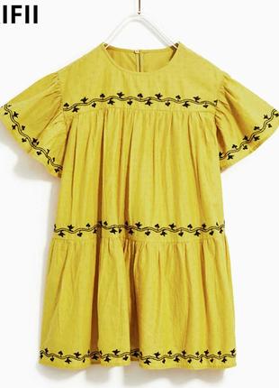Жовте багатоярусне плаття для дівчинки з вишивкою