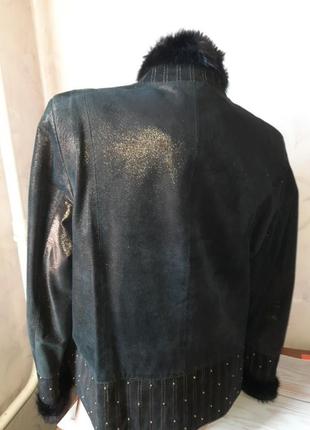 Шкіряна куртка, оздоблена норкою3 фото