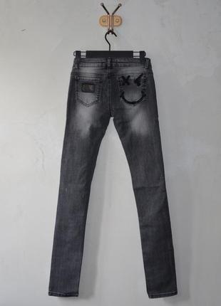 Джинсы  рваные amn madness national