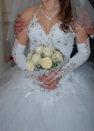 Продаю весільну сукню у відмінному стані  + бонус2 фото