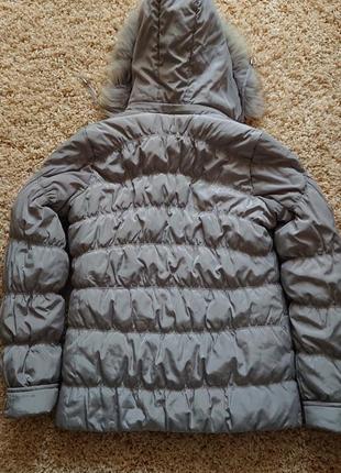 Зимова жіноча куртка з капюшоном та хутрової апушкой р. 44 /46/486 фото