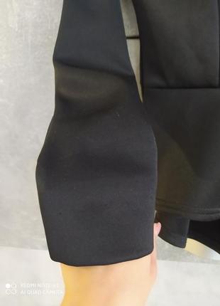 Жакет чорного кольору ззаду з баскою3 фото