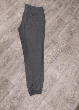 Жіночі теплі брюки на манжетах.3 фото
