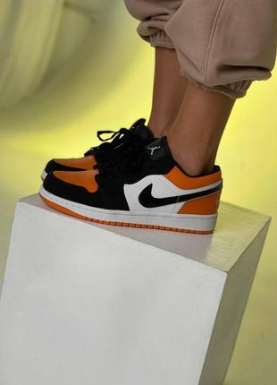 Жіночі кросівки nike air jordan retro 1 low black orange white2 фото