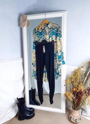 Трендові легінси в рубчик зі зборками знизу