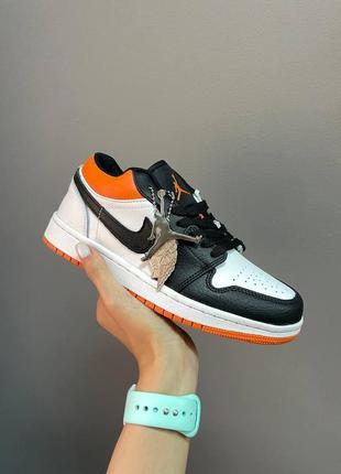 Жіночі кросівки nike air jordan retro 1 low black white orange9 фото