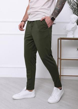 Трикотажные штаны цвета хаки с накладным карманом1 фото