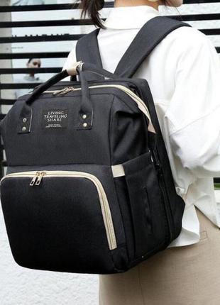 Универсальный рюкзак-кроватка для мам по уходу за детьми living traveling share. цвет: черный2 фото