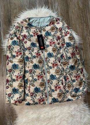 Двостороння жіноча нова куртка