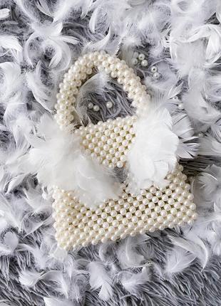 Сумка з намистин і пір'я