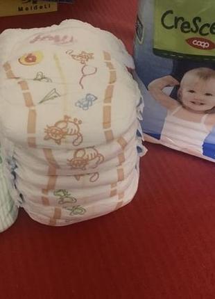 Новая упаковка памперсы и трусики в подарок