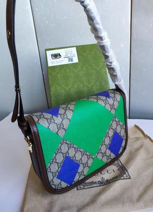 Шикарна коричнева  брендова  сумка клатч через плече5 фото