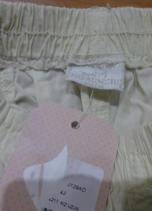 Красивая хлопковая юбка молочная с зеленой рюшкой новая с бирками 3-4 года3 фото