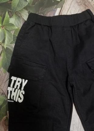 Коттоновые брюки - джоггеры, на резинке, с накладными карманами7 фото