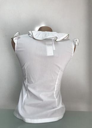 Блуза рубашка без рукава женская с воланом белая приталенная6 фото