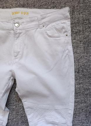 Білі стрейчеві  джинси скінні /розмір 14.3 фото