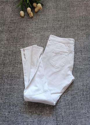 Білі стрейчеві  джинси скінні /розмір 14.4 фото