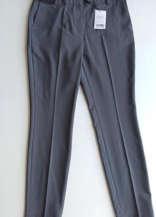 Классические качественные серые брюки зауженные к низу5 фото
