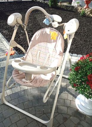 Крісло-гойдалка-годувальний столик