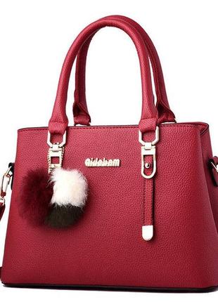 Модная женская сумка с меховым брелоком красный1 фото