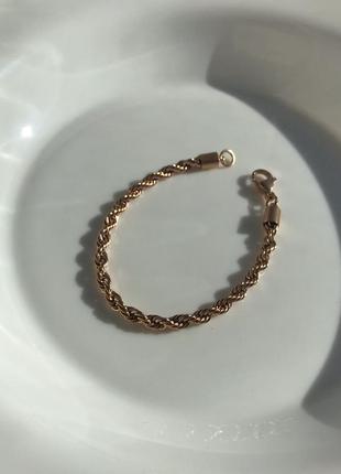 Шикарный плетеный браслет цвета розовое золото