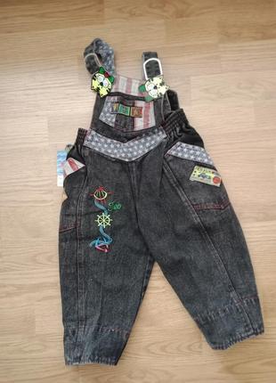 Детский новый комбинезон черного цвета унисекс