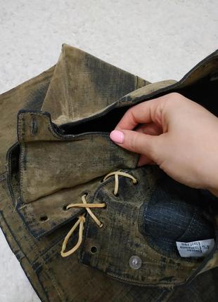 Крутая джинсовая юбка протертость со шнуровкой хаки цвета4 фото