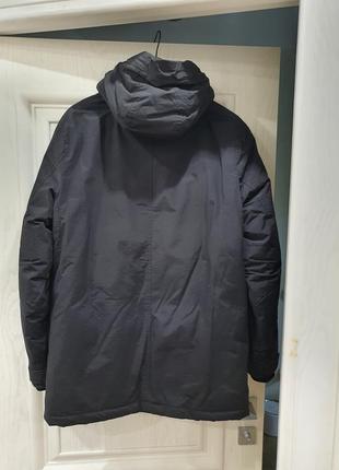 Чоловіча зимова куртка-парка чорного кольору10 фото