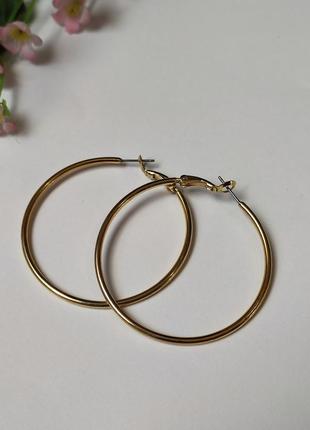 Сережки кольца під золото1 фото